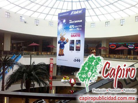 Producción e instalación de material publicitario para Telcel en plazas comerciales y flotilla